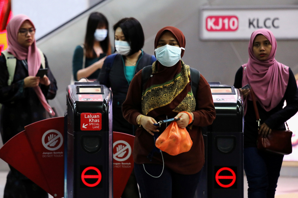 Passengers wear masks at a Light Rail Transit station in Kuala Lumpur January 31, 2020. u00e2u20acu201d Reuters pic
