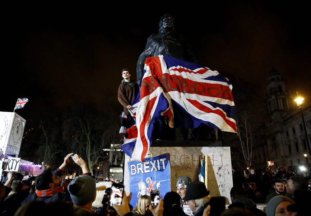People celebrate at the statue of Winston Churchill as Britain leaves the EU on Brexit day in London January 31, 2020. u00e2u20acu201d Reuters pic
