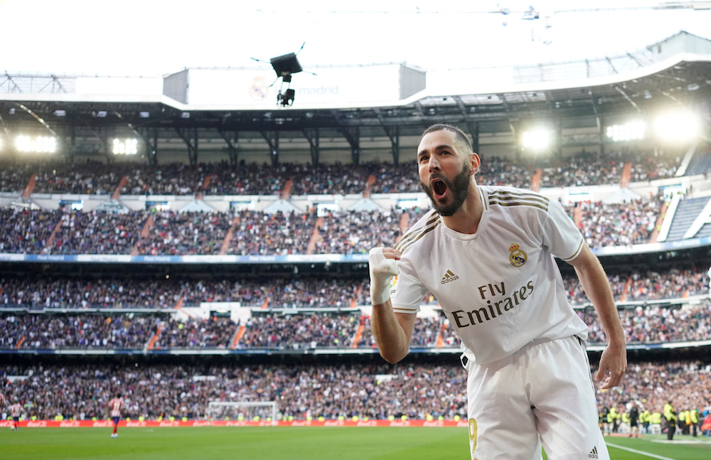 Real Madridu00e2u20acu2122s Karim Benzema celebrates scoring their first goal during the La Liga match with Atletico Madrid at Santiago Bernabeu in Madrid February 1, 2020. u00e2u20acu201d Reuters pic