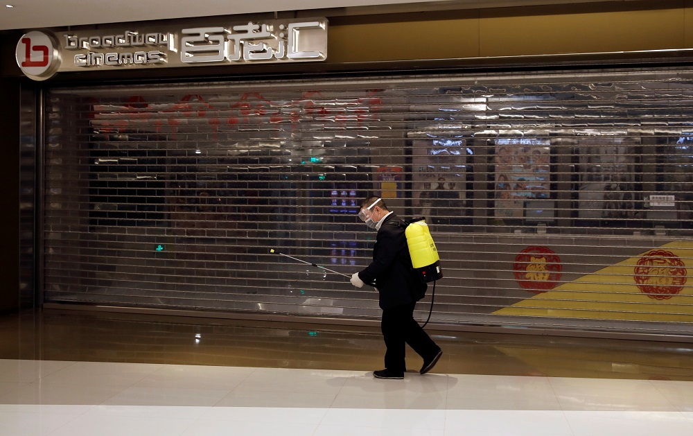 A staff member carrying sanitising equipment walks past a closed cinema at a shopping mall, as the country is hit by an outbreak of the new coronavirus, in Beijing February 3, 2020. u00e2u20acu201d Reuters pic