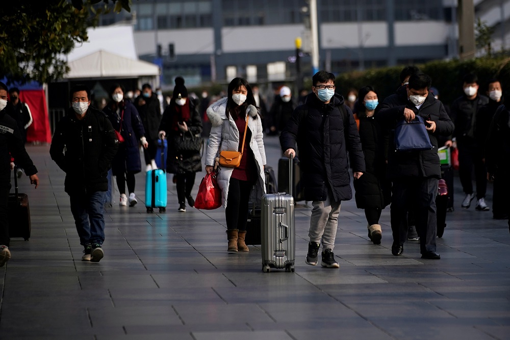 Passengers wearing masks walk at the Shanghai railway station in China, as the country is hit by an outbreak of the novel coronavirus, February 9, 2020. u00e2u20acu201d Reuters pic