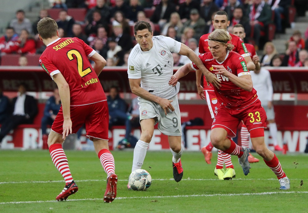 Bayern Munich's Robert Lewandowski in action with FC Cologne's Sebastiaan Bornauw at the Rhein Energie Stadium in Cologne February 16, 2020. u00e2u20acu201d Reuters pic