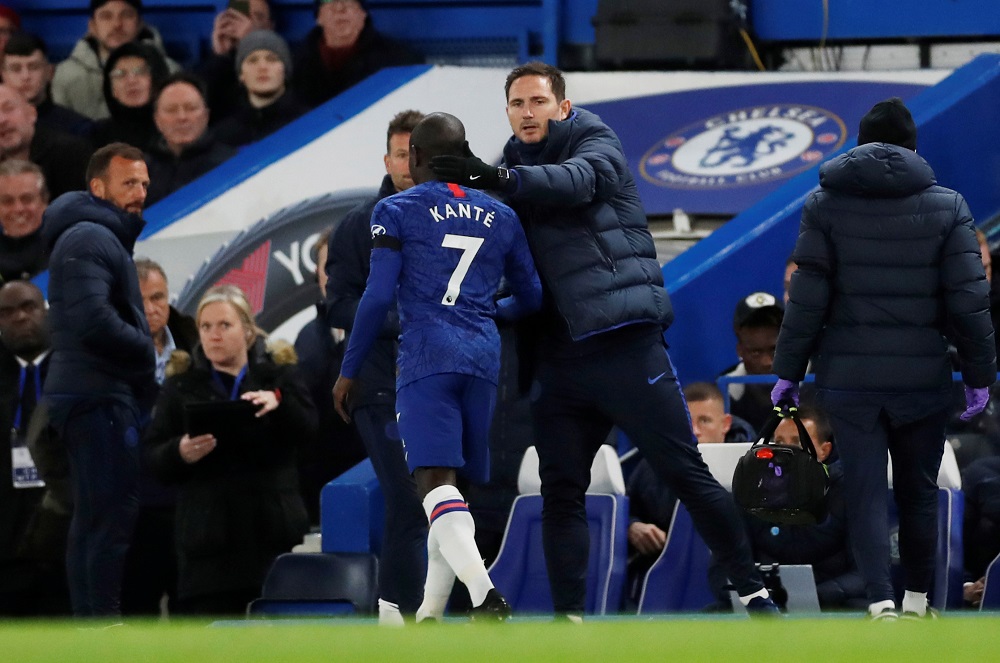 Chelsea's N'Golo Kante is patted on the head by manager Frank Lampard as he leaves the pitch after sustaining an injury during the match against Manchester United at Stamford Bridge in London February 17, 2020. u00e2u20acu201d Action Images via Reuters
