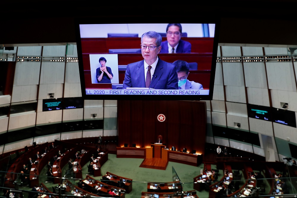 Hong Kong Financial Secretary Paul Chan is seen on a screen as he delivers his annual budget at the Legislative Council in Hong Kong February 26, 2020. u00e2u20acu201d Reuters pic