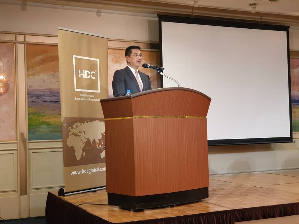 Economic Affairs Minister Datuk Seri Mohamed Azmin Ali speaks during the signing ceremony between Halal Industry Development Corporation and AcrosX Japan Inc in Tokyo February 1, 2020. u00e2u20acu201d Picture via Twitter/Mohamed Azmin Ali