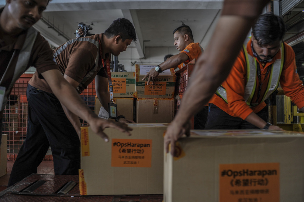 MASkargo workers are seen loading of supplies consisting of N95 masks, surgical masks and gloves during the Ops Harapan, MASkargo and Yunda press conference on first humanitarian shipment to China in Sepang, February 4, 2020. — Picture by Shafwan Zaido