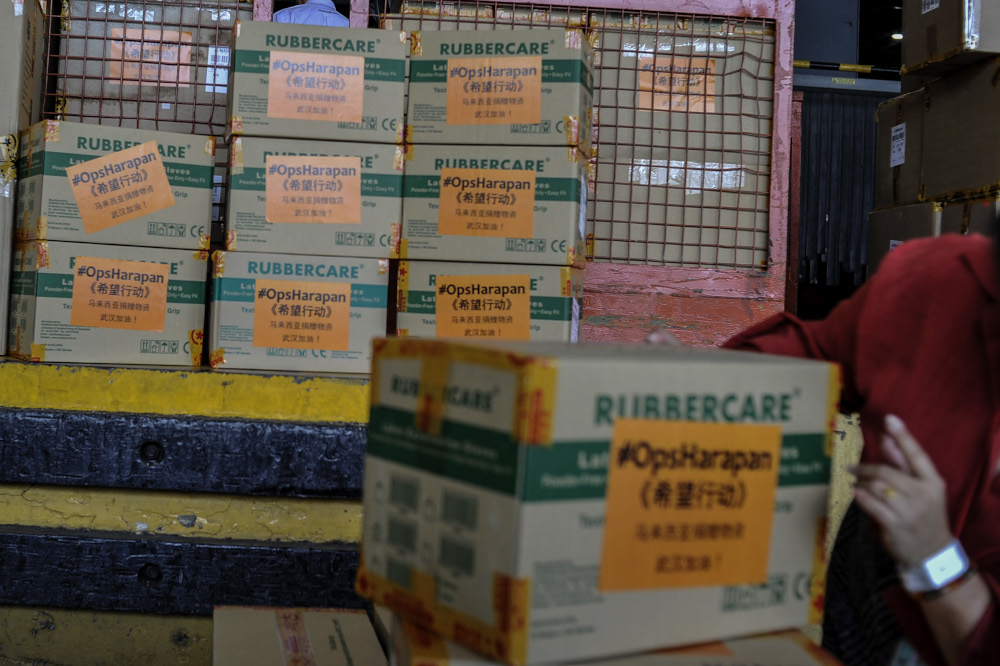 Cartons of supplies consisting of N95 masks, surgical masks and gloves are seen in the warehouse during the Ops Harapan, MAS Kargo and Yunda press conference on first humanitarian shipment to China in Sepang, February 4, 2020. u00e2u20acu201d Picture by Shafwan Zaido