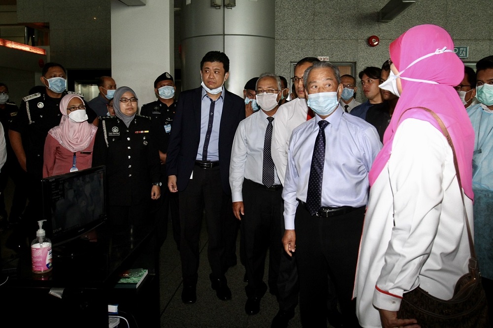 Home Minister Tan Sri Muhyiddin Yassin (second right) being briefed on the screening procedures at the Bangunan Sultan Iskandar Customs, Immigration and Quarantine Complex in Johor Baru February 4, 2020. u00e2u20acu201d Picture by Ben Tan