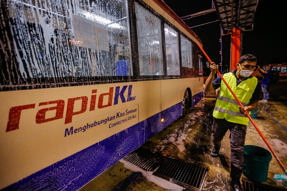 Rapid KL workers are seen washing a bus at the Rapid KL depot in Kuala Lumpur February 7, 2020. u00e2u20acu201d Picture by Hari Anggara