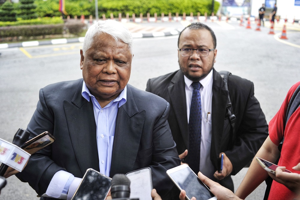 Datuk Mohd Tamrin Abdul Ghafar (left) and his lawyer Mohd Azharul Ab Talib speak to the media after giving his statement at Bukit Aman in Kuala Lumpur February 10, 2020. u00e2u20acu201d Picture by Shafwan Zaidon