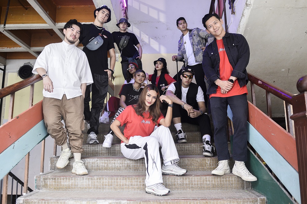 AirAsia Group head of brand Rudy Khaw (left) and PMC chief executive officer and co-founder Hugh Koh (right) pose with models sporting pieces from the collection. u00e2u20acu201d Picture by Miera Zulyana