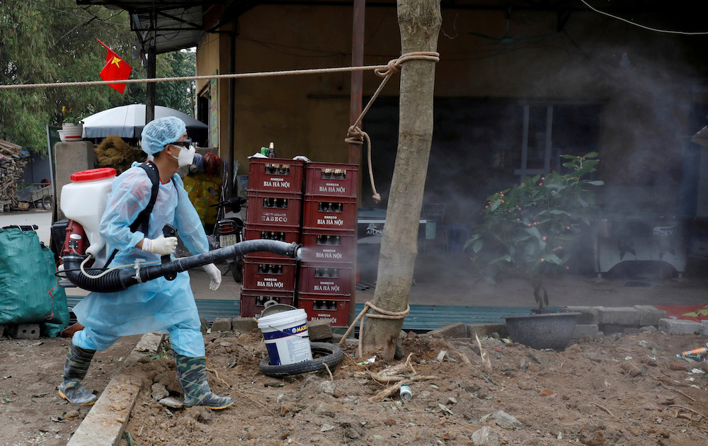 A Vietnamese health worker sprays chemicals to disinfect an area in Vinh Phuc province, Vietnam February 12, 2020. u00e2u20acu201d Reuters pic