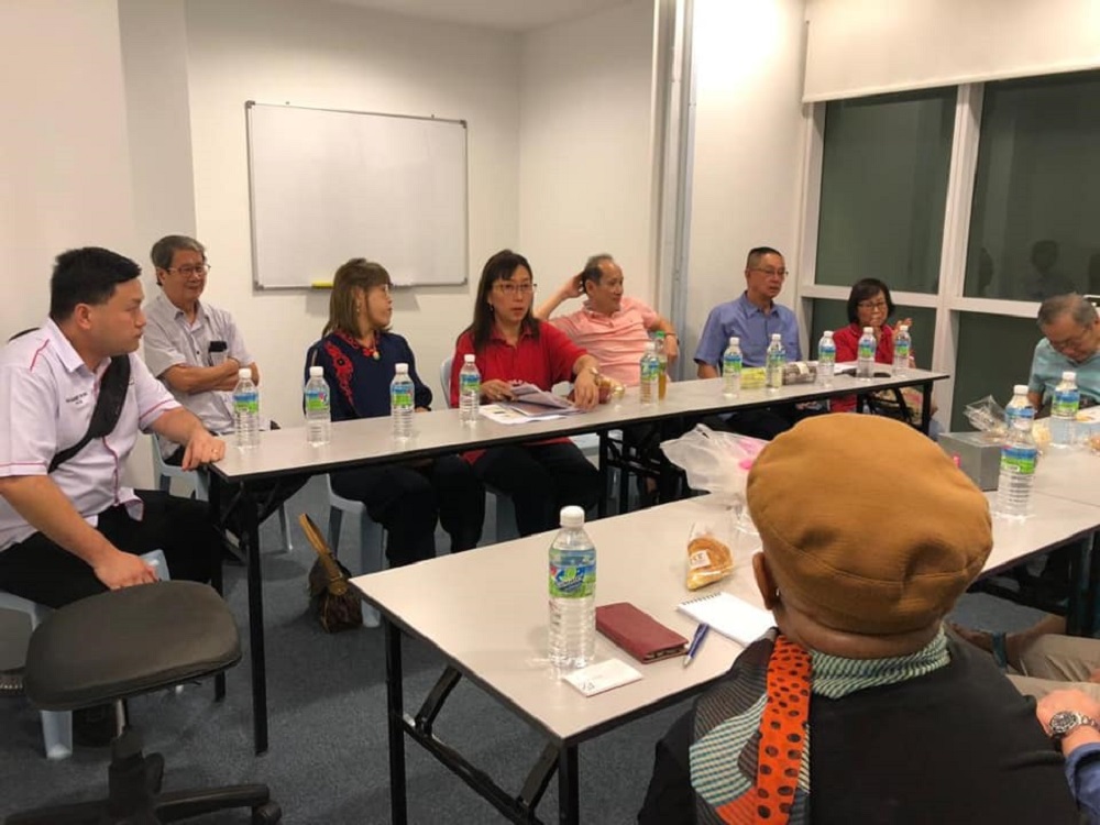 Seputeh MP Teresa Kok (centre) during a meeting with Taman Desa residents following the partial collapse of a condominium construction collapse here last week. u00c2u00ac Picture via Facebook/Teresa Kok