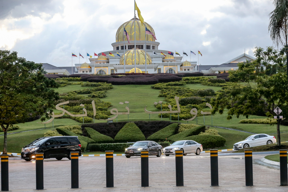 Luxury vehicles believed to be carrying senior political leaders leave Istana Negara February 23, 2020. u00e2u20acu201d Picture by Firdaus Latif
