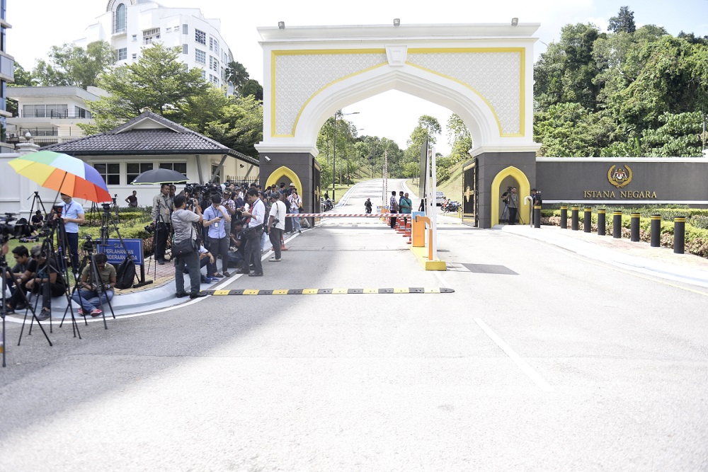 Members of the media gather in front of the Istana Negara to wait for the arrival of Barisan National and PAS MPs, in Kuala Lumpur February 25, 2020. u00e2u20acu201d Picture by Miera Zulyanann
