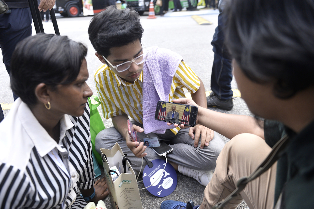 Members of media watch the live telecast of Interim Prime Minister Tun Dr Mahathir Mohammad at Istana Negara February 26, 2020. u00e2u20acu201d Picture by Miera Zulyana