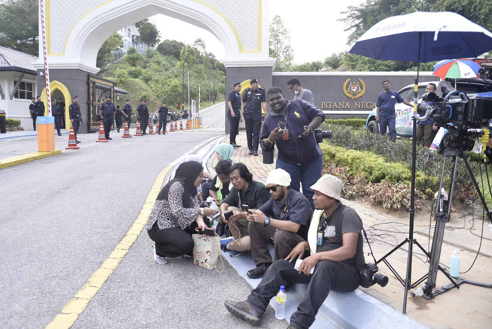 Members of the media gather in front of Istana Negara February 26, 2020. u00e2u20acu201d Picture by Miera Zulyana