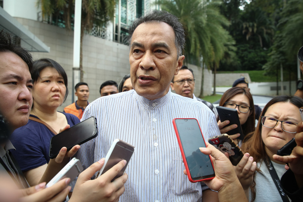 Datuk Husam Musa speaks to reporters outside the Yayasan Al-Bukhary in Kuala Lumpur February 29, 2020. u00e2u20acu201d Picture by Yusof Mat Isa