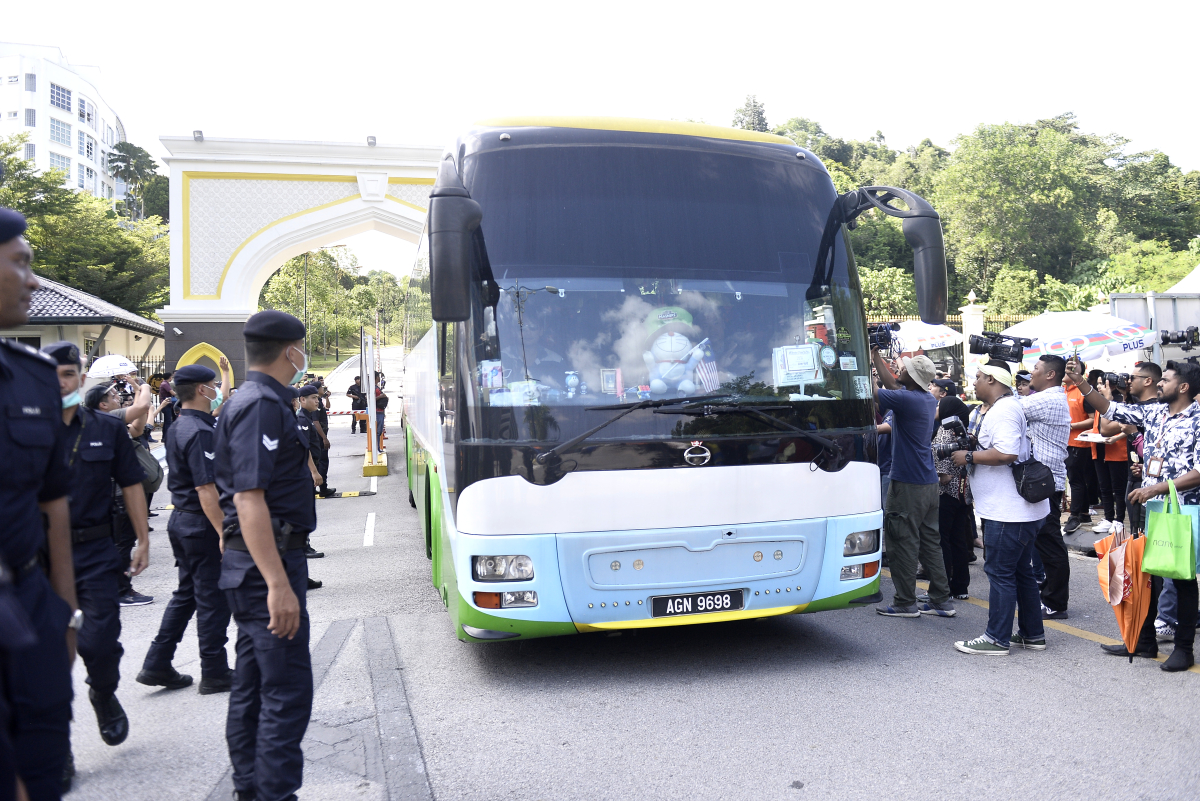 A bus carrying members of DAP is seen leaving Istana Negara on February 26, 2020. u00e2u20acu201d Picture by Miera Zulyana
