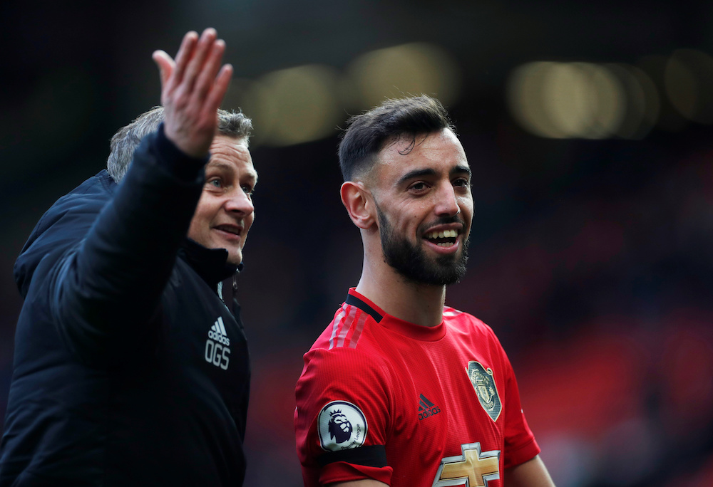 Manchester United manager Ole Gunnar Solskjaer celebrates with Bruno Fernandes after the match, February 23, 2020. u00e2u20acu201d Action Images via Reuters/Lee Smith 