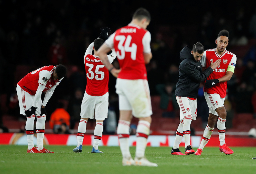 Arsenal's Pierre-Emerick Aubameyang is consoled by Dani Ceballos after the match against Olympiacos, February 27, 2020. u00e2u20acu201d Reuters pic 
