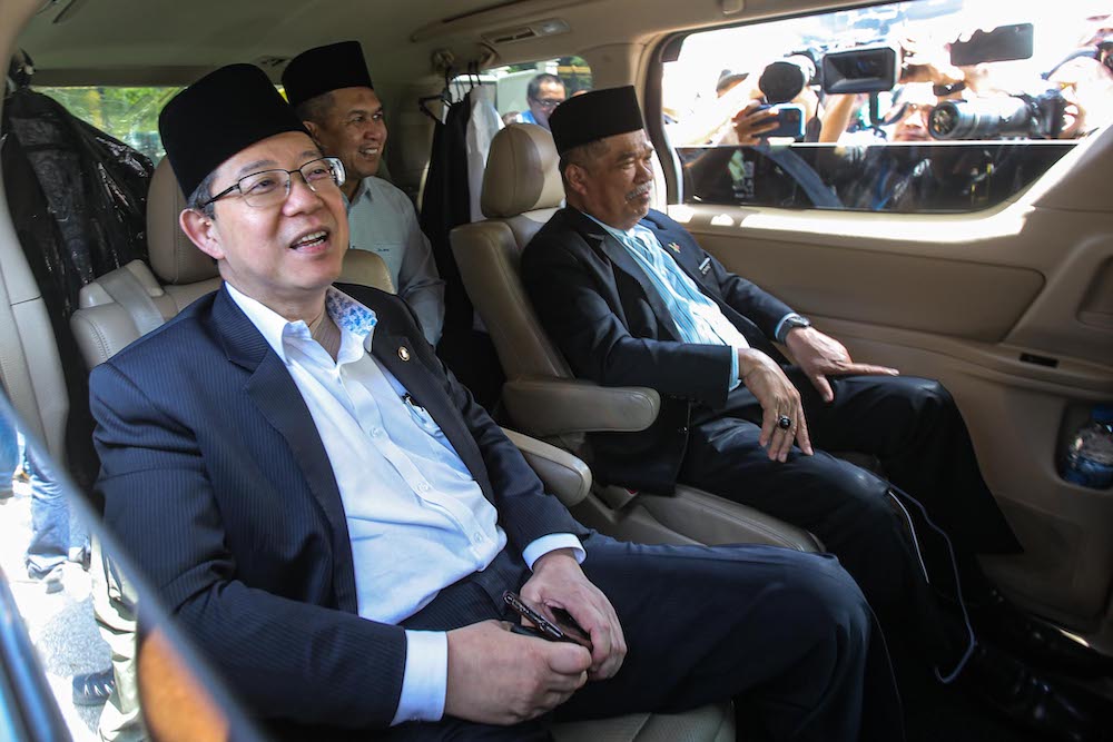 DAP secretary-general Lim Guan Eng and Parti Amanah Negara president Mohamad Sabu are seen leaving Istana Negara, February 29, 2020. u00e2u20acu201d Picture by Hari Anggara