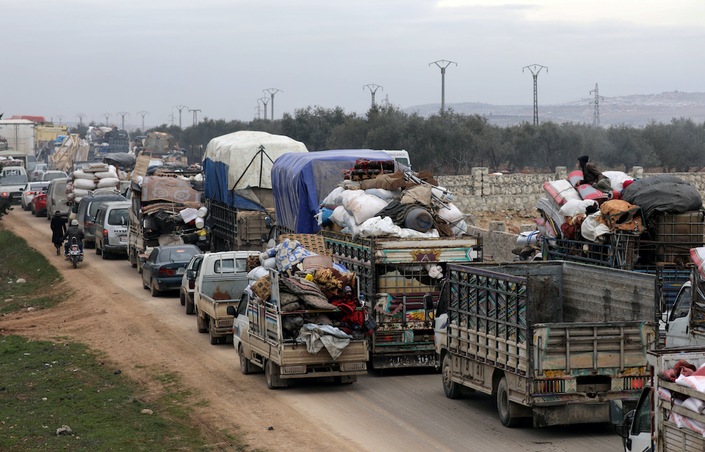 A general view of vehicles carrying belongings of internally displaced Syrians from western Aleppo countryside, in Hazano near Idlib, Syria, February 11, 2020. u00e2u20acu201d AFP picnn