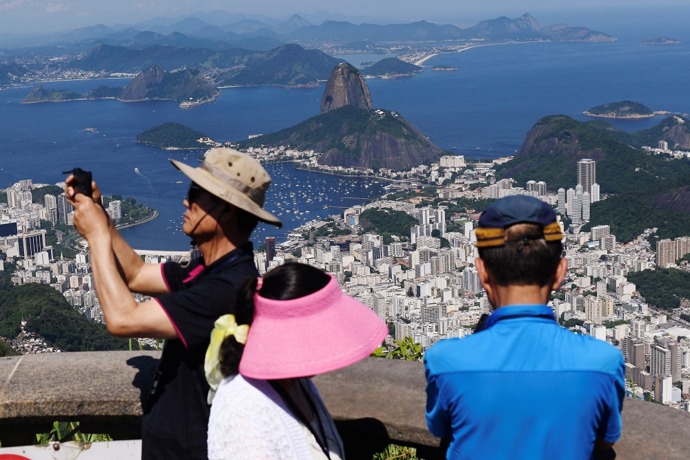 Tourists are seen on top of Corcovado Mountain with the Sugarloaf Mountain in the background in Rio de Janeiro, Brazil January 31, 2020. u00e2u20acu201d Reuters pic 