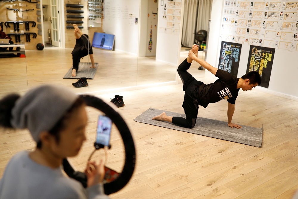 Trainer Wang Kai teaches a class that is being livestreamed at a gym, as the country is hit by an outbreak of the new coronavirus, in Beijing February 14, 2020. u00e2u20acu201d Reuters pic   