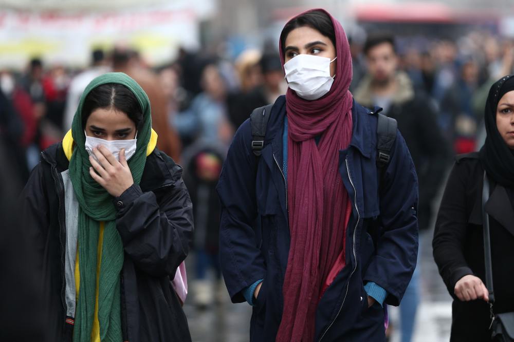 Iranian women wear protective masks to prevent contracting a coronavirus, as they walk at Grand Bazaar in Tehran February 20, 2020. u00e2u20acu2022 WANA (West Asia News Agency)/Nazanin Tabatabaee pic via Reuters 