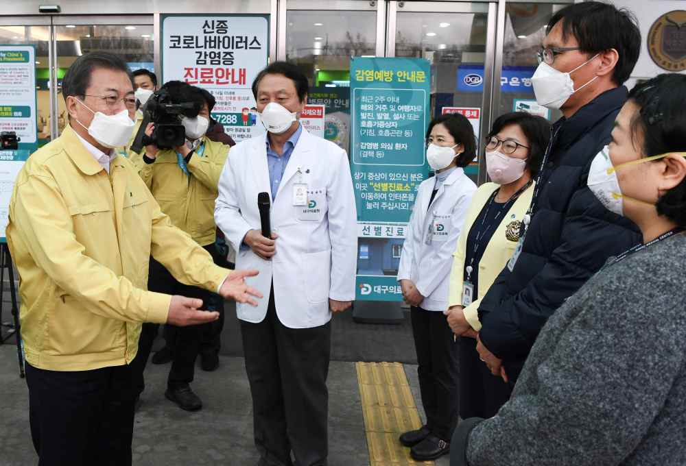 South Korea's President Moon Jae-in gets briefed during his visit to a medical centre in Daegu, South Korea February 25, 2020. u00e2u20acu2022 Handout via Reutersn