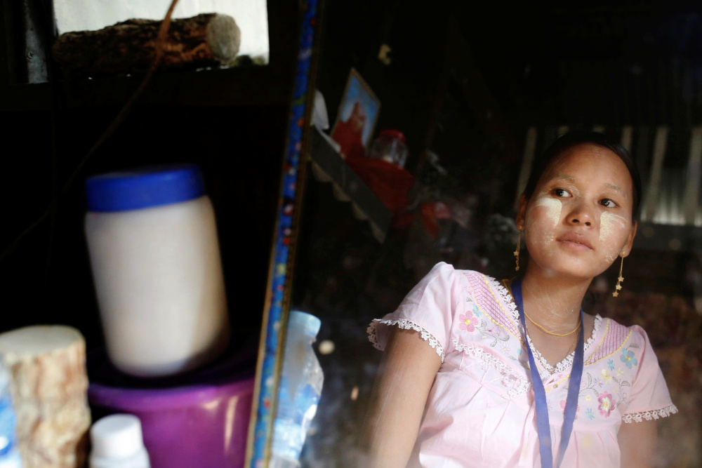 Aye Su Thana, 31, who used to work at Hunter Myanmar, a factory that makes clothes for an Italian fashion brand that suddenly suspended their production in mid February, looks in the mirror at her home in Yangon, Myanmar February 28, 2020. u00e2u20acu201d Reuters pic