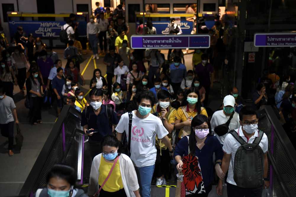 Commuters wearing protective masks walk inside the MRT subway in Bangkok February 24, 2020. u00e2u20acu2022 Reuters pic