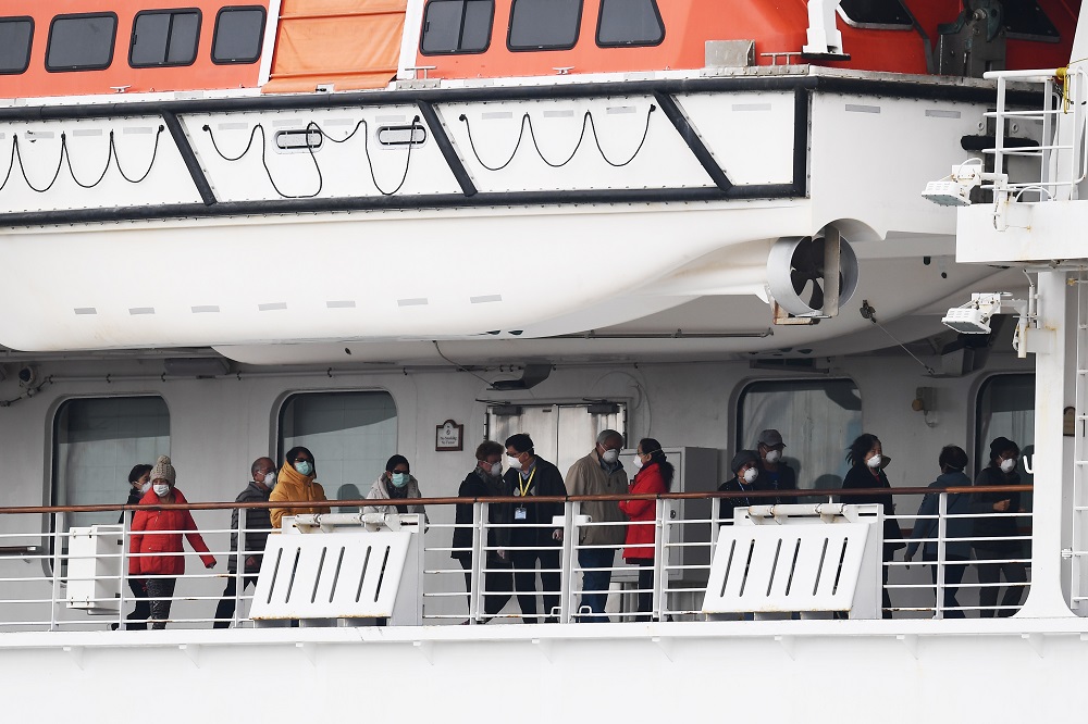 Passengers walk along the deck of the Diamond Princess cruise ship, with around 3,600 people quarantined onboard due to fears of the new Covid-19 coronavirus, at the Daikoku Pier Cruise Terminal in Yokohama February 14, 2020. u00e2u20acu201d AFP pic 