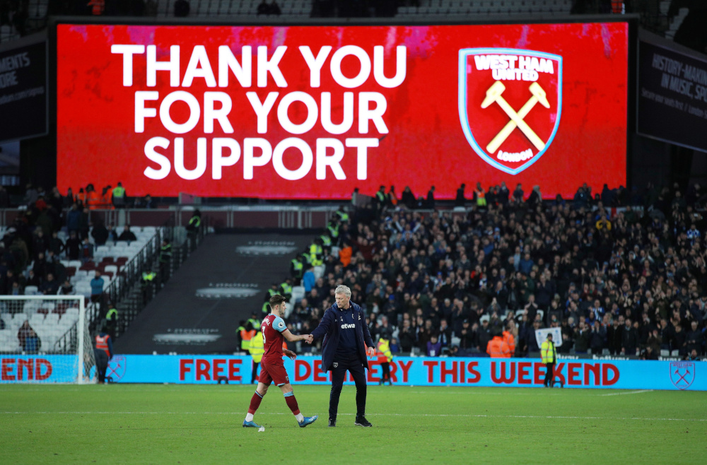 West Ham United manager David Moyes shakes hands with Aaron Cresswell after the match with Brighton & Hove Albion at London Stadium, February 1, 2020. u00e2u20acu201d Reuters pic 