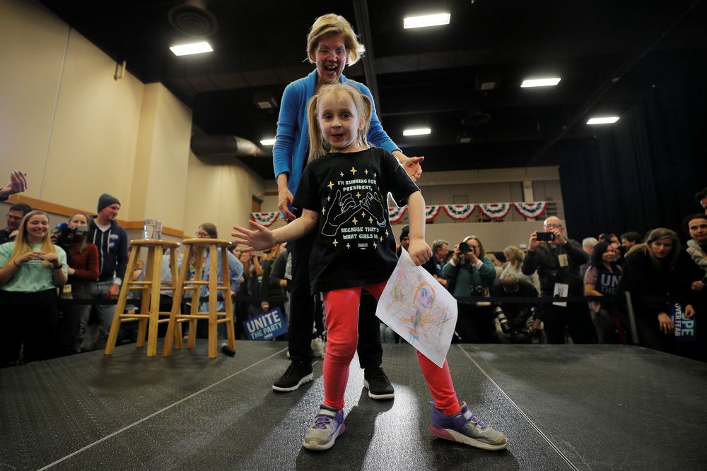 Democratic 2020 US presidential candidate and US Senator Elizabeth Warren (D-MA) reacts as a young girl from the audience dances onstage at a Get Out the Caucus rally in Davenport, Iowa, US, February 1, 2020. u00e2u20acu201d Reuters pic