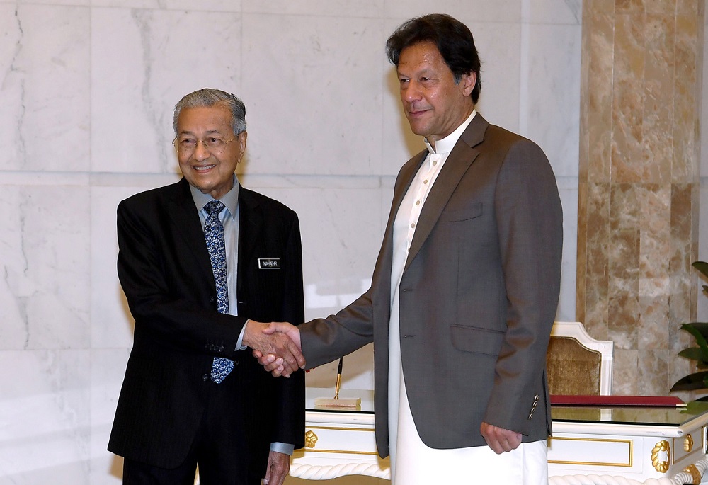 Prime Minister Tun Dr Mahathir Mohamad shaking hands with Pakistan's Prime Minister Imran Khan at the Perdana Putra in Putrajaya February 4, 2020. u00e2u20acu201d Bernama pic