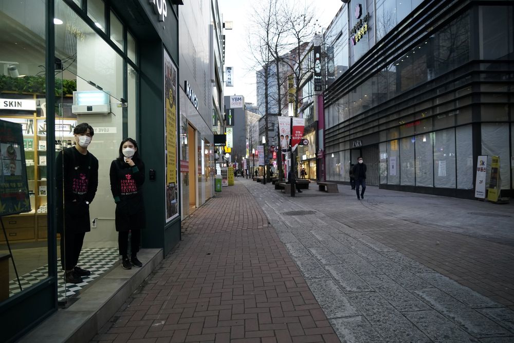 Shopkeepers wearing masks to prevent contracting the coronavirus wait for a customer at Dongseong-ro shopping street in central Daegu, South Korea February 21, 2020. u00e2u20acu201d Reuters pic
