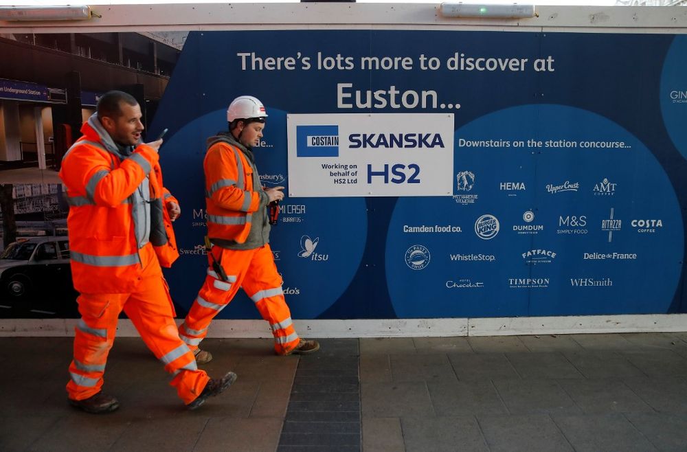 Workers walk past a sign outside a construction site for a section of Britainu00e2u20acu2122s HS2 high-speed two railway project, at London Euston train station in London on January 20, 2020. u00e2u20acu201d AFP pic