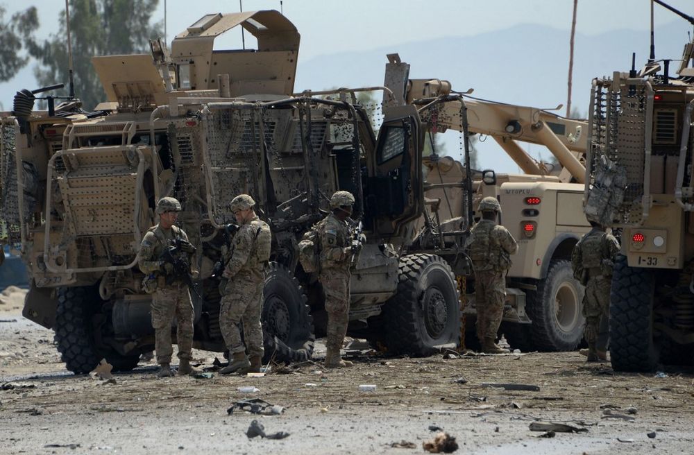 In this file photo taken on April 10, 2015 US soldiers inspect the scene of a suicide bomb attack near the airport in the Afghan city of Jalalabad. u00e2u20acu201d AFP pic
