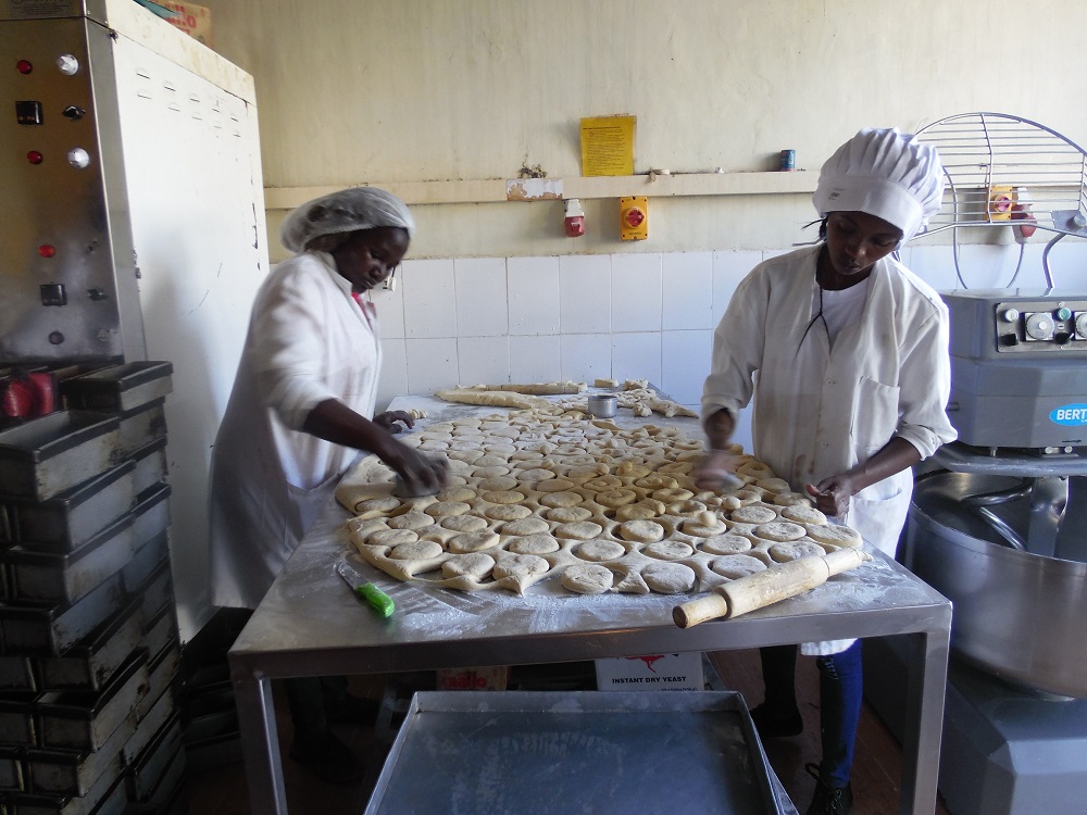 Workers produce sweet potato products at a processing factory in Maua, Meru County, Kenya January 26, 2020. u00e2u20acu201d Thomson Reuters Foundation pic