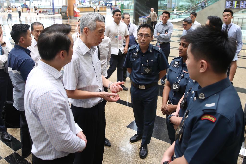 Singapore Prime Minister Lee Hsien Loong interacts with Cisco officers at Changi Airport Terminal 3 February 14, 2020. u00e2u20acu201d TODAY pic