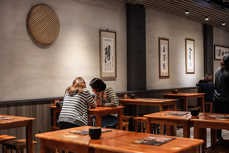 The décor is minimalist with a few frames of Chinese calligraphy.