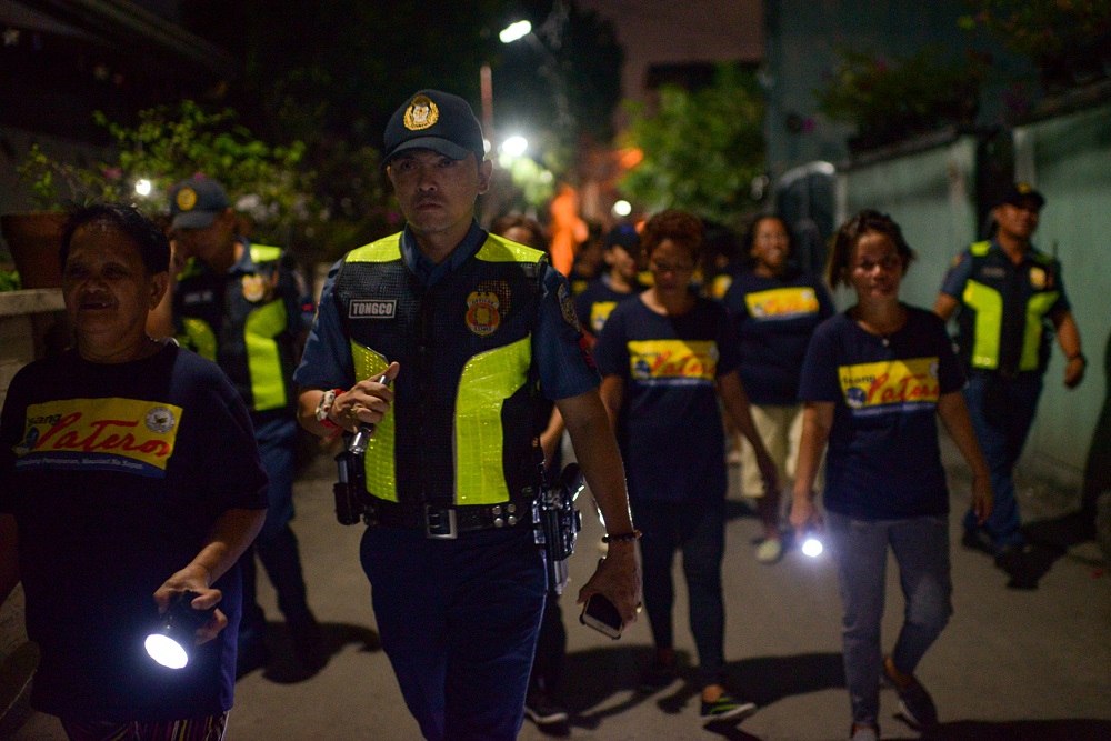 Members of a volunteer group of women patrol with police officers on the streets of Pateros, Metro Manila, Philippines December 18, 2019. u00e2u20acu201d Reuters pic 