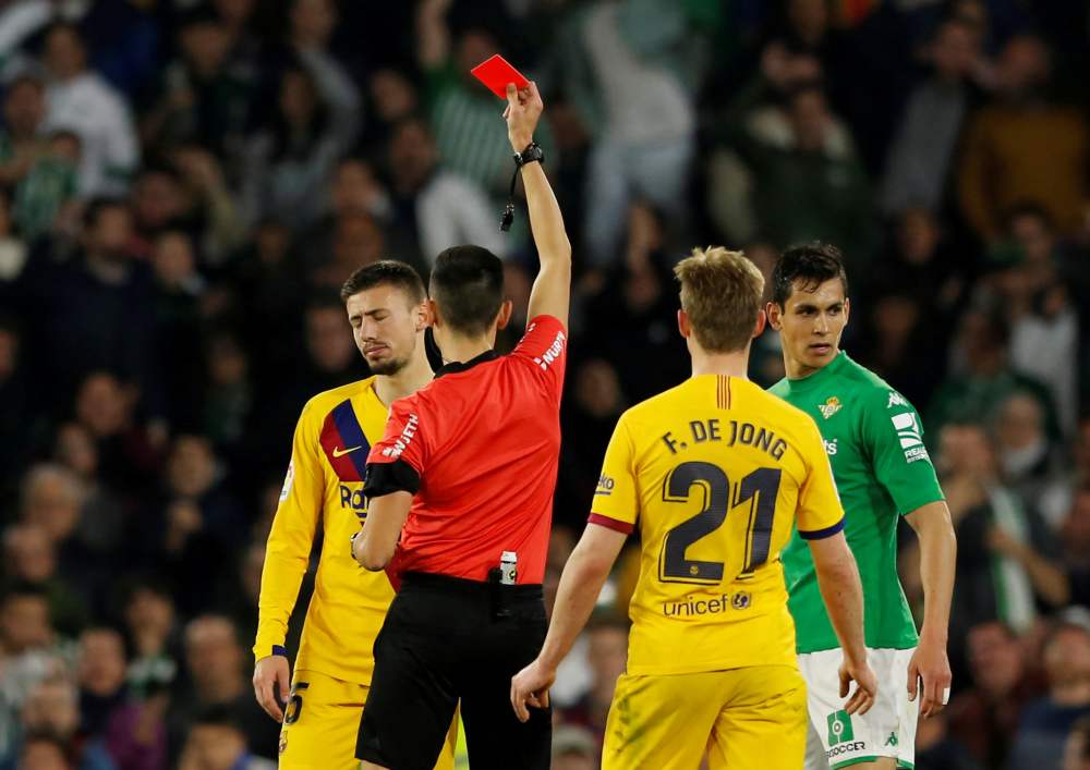 Barcelona's Clement Lenglet is shown a red card by referee Sanchez Martinez during the match against Real Betis February 9, 2020. u00e2u20acu2022 Reuters pic