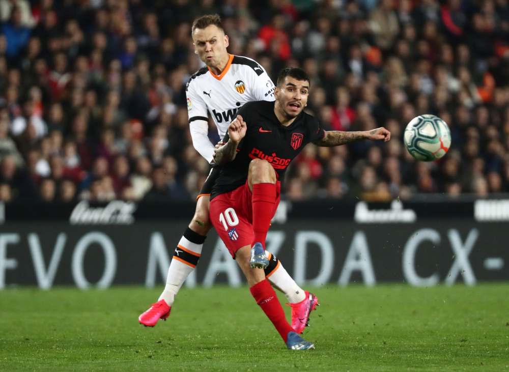Atletico Madrid's Angel Correa in action with Valencia's Denis Cheryshev, February 15, 2020. u00e2u20acu2022 Reuters pic