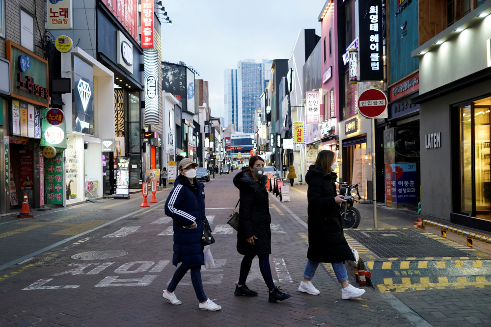 Women wearing masks to prevent contracting Covid-19 walk at Dongseong-ro shopping street in central Daegu, South Korea February 21, 2020. u00e2u20acu201d Reuters pic 