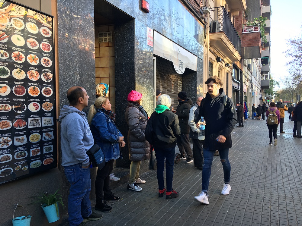 Members of advocacy group Stop Desahucios gather outside Zafaru00e2u20acu2122s home on the day of his eviction in Barcelona December 9, 2019. u00e2u20acu201d Thomson Reuters Foundation 