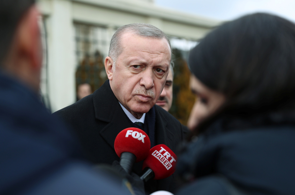 Turkish President Tayyip Erdogan talks to journalists in front of a mosque as he leaves friday prayers in Istanbul, Turkey, February 21, 2020. u00e2u20acu201d Murat Cetinmuhurdar/Presidential Press Office handout pic via Reuters 