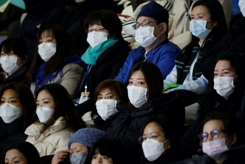 Spectators wearing masks to prevent contacting to a new coronavirus attend Four Continents Figure Skating Championships 2020 in Seoul, South Korea, February 7, 2020. u00e2u20acu201d Reuters picnn